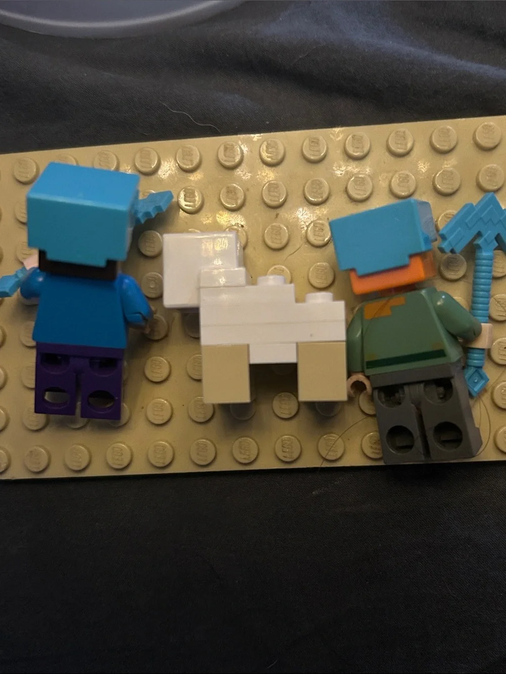 Lego Minecraft figures: Alex, Steve, sheep